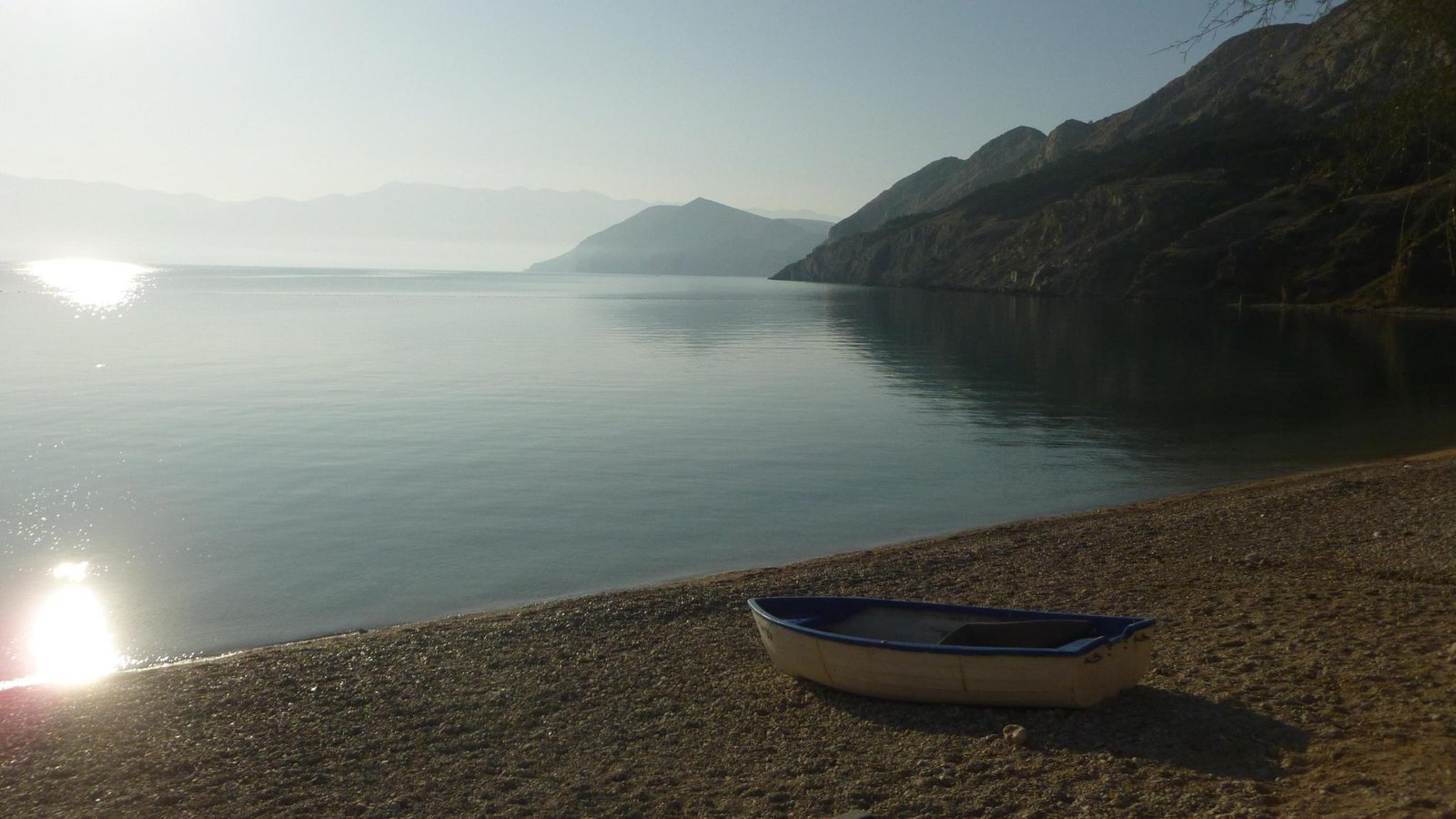 Uncrowded beach at sunrise in Baška, Croatia