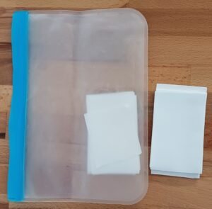 Laundry detergent sheets in a reusable silicone storage bag